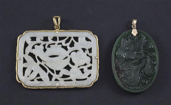 Two Chinese jade plaques, 5.3cm., the mount marked 18K